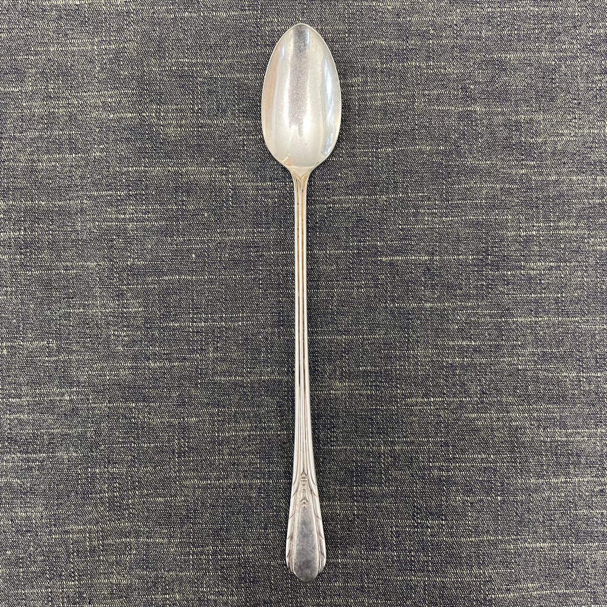 antique silver long handled teaspoon for serving jam or prop photography