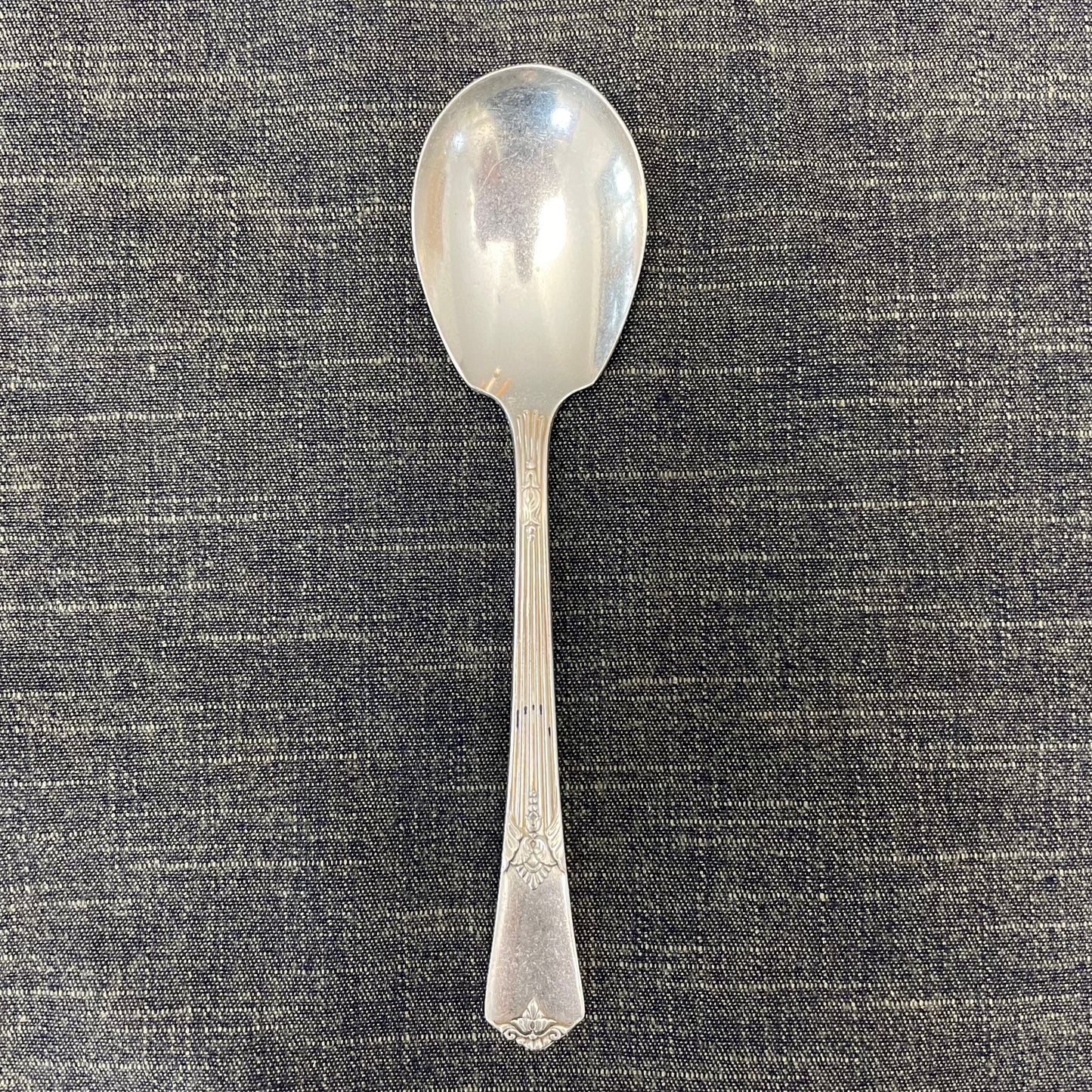 antique silver small serving spoon for serving or prop photography