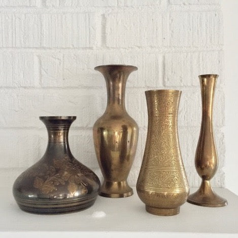 vintage brass vase with an etched floral and foliage pattern