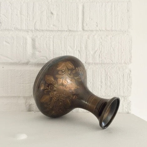 vintage brass vase with an etched floral and foliage pattern
