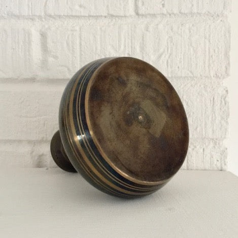 vintage brass vase with an etched floral and foliage pattern