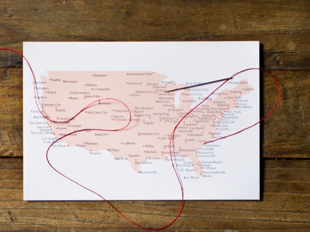 US stitching travel postcard with needle and thread