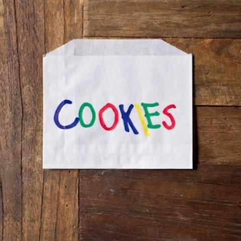 white glassine bags with rainbow cookies printed on the front