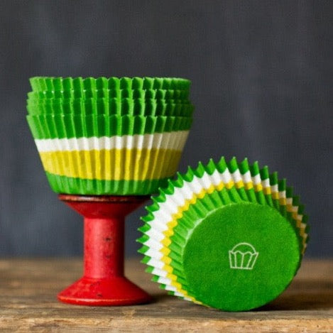 green, lime green, and white paper cupcake liners for circus party supplies