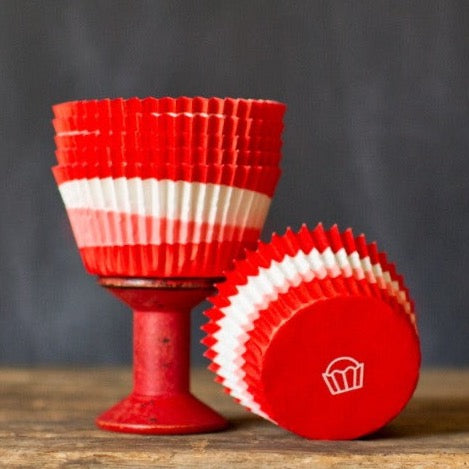 red, pink, and white paper cupcake liners for circus party supplies