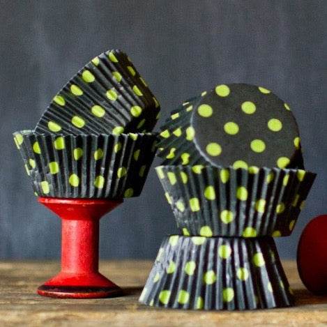 neon green and black polka dot paper cupcake liners