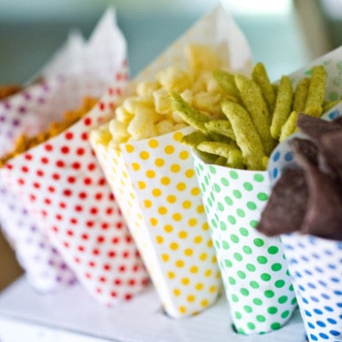 polka dot paper party cones available in red, yellow, green, blue, and purple for party supplies