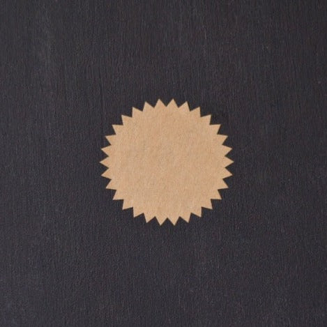 tan kraft round starburst sticker labels