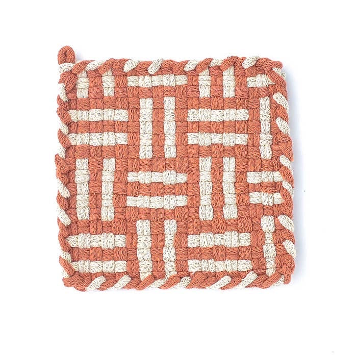 rust and cream handmade 100 percent cotton geometric woven potholder or trivet for a farmhouse kitchen