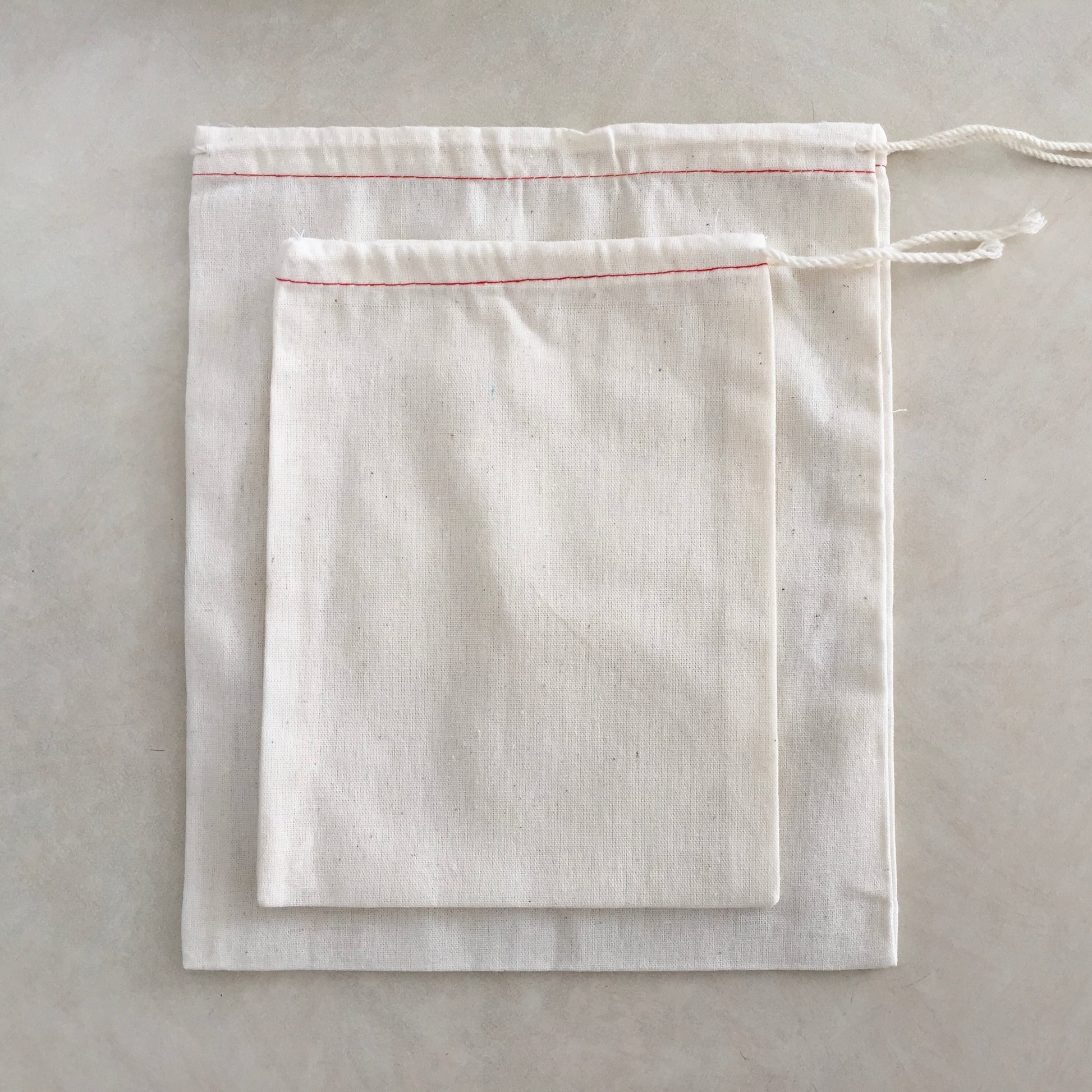 cotton muslin drawstring parts bags with red stitching