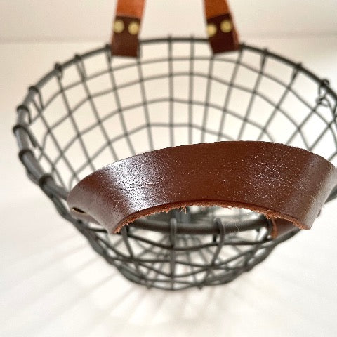 woven iron metal round fruit basket with cognac brown leather handles