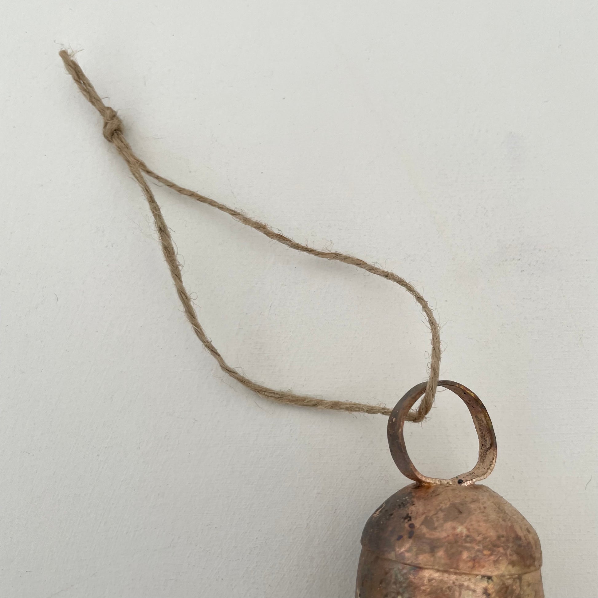 2 1/4" rustic rounded top tin bell with brass finish ornament on jute