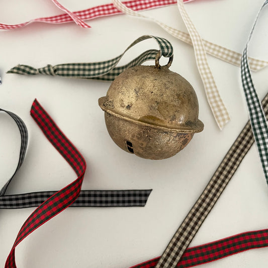 2 1/2" cross-cut brass sleigh bell made in India strung on check gingham taffeta ribbon made in Japan for door hanger