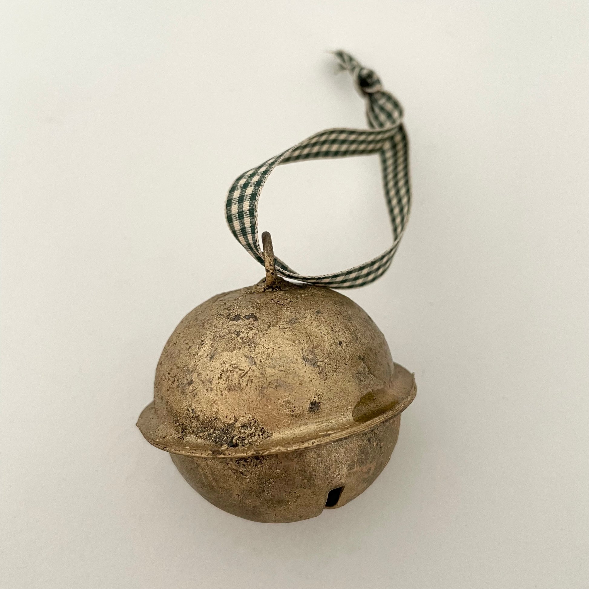 2 1/2" cross-cut brass sleigh bell made in India strung on check gingham taffeta ribbon made in Japan for door hanger