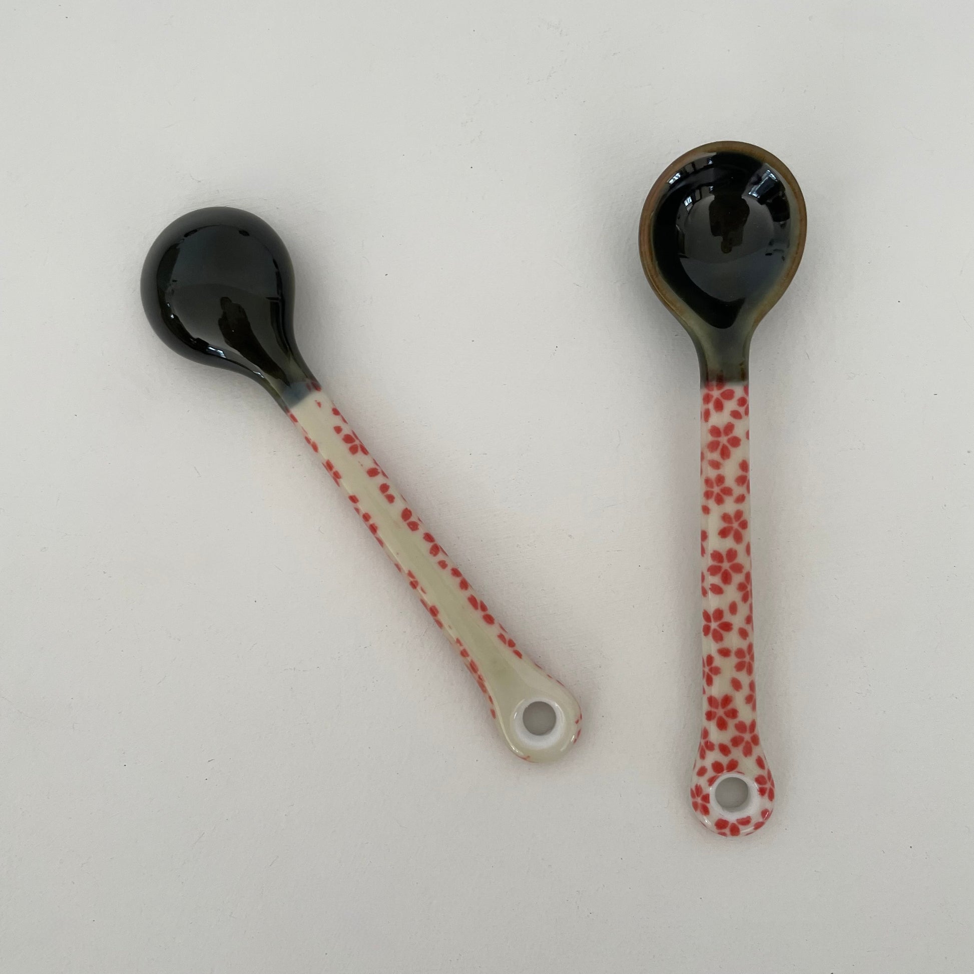 handmade small Japanese pottery spoon for coffee or tea in red and cream flower pattern