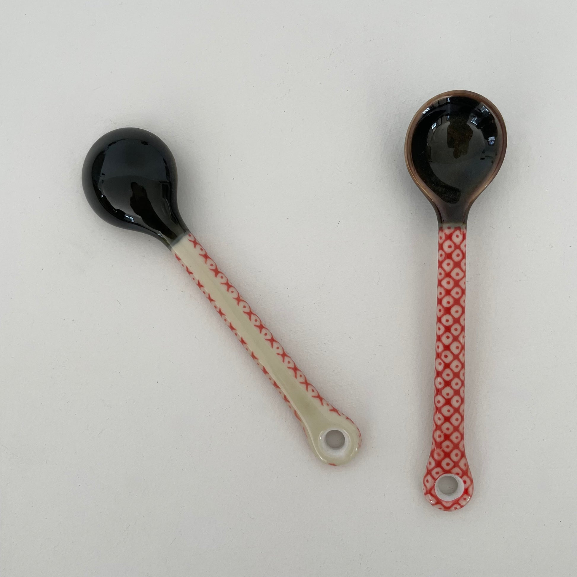 handmade small Japanese pottery spoon for coffee or tea in red and cream dot pattern