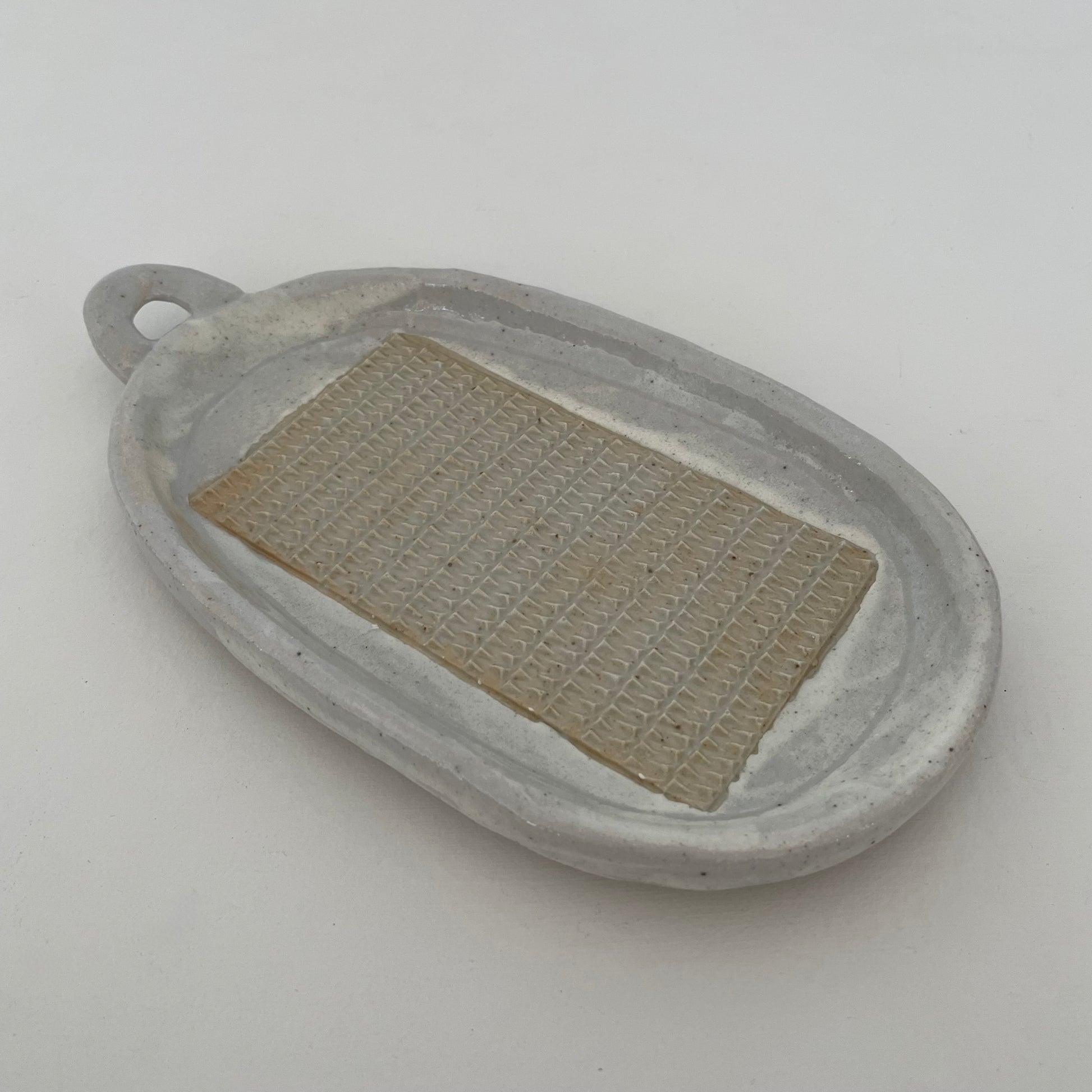 neutral grey and cream gohonte handmade ceramic pottery Japanese large oval food grater with handle