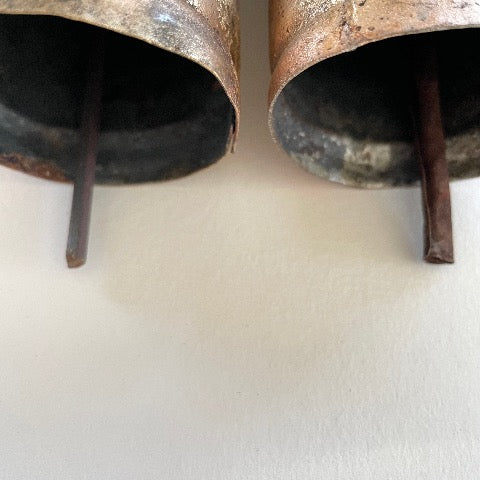 photo showing the difference in metal strikers on the 5 1/2 inch flat top bell
