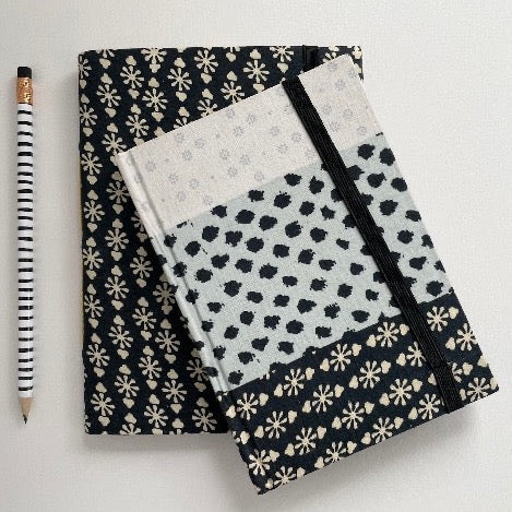 neutral black, cream, and blue fabric covered handmade unlined notebook journal