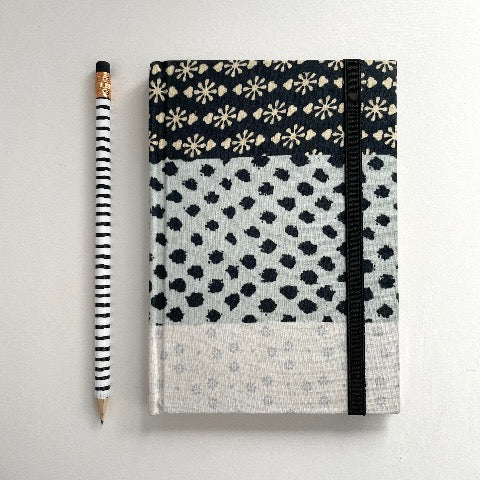 neutral black, cream, and blue fabric covered handmade unlined notebook journal