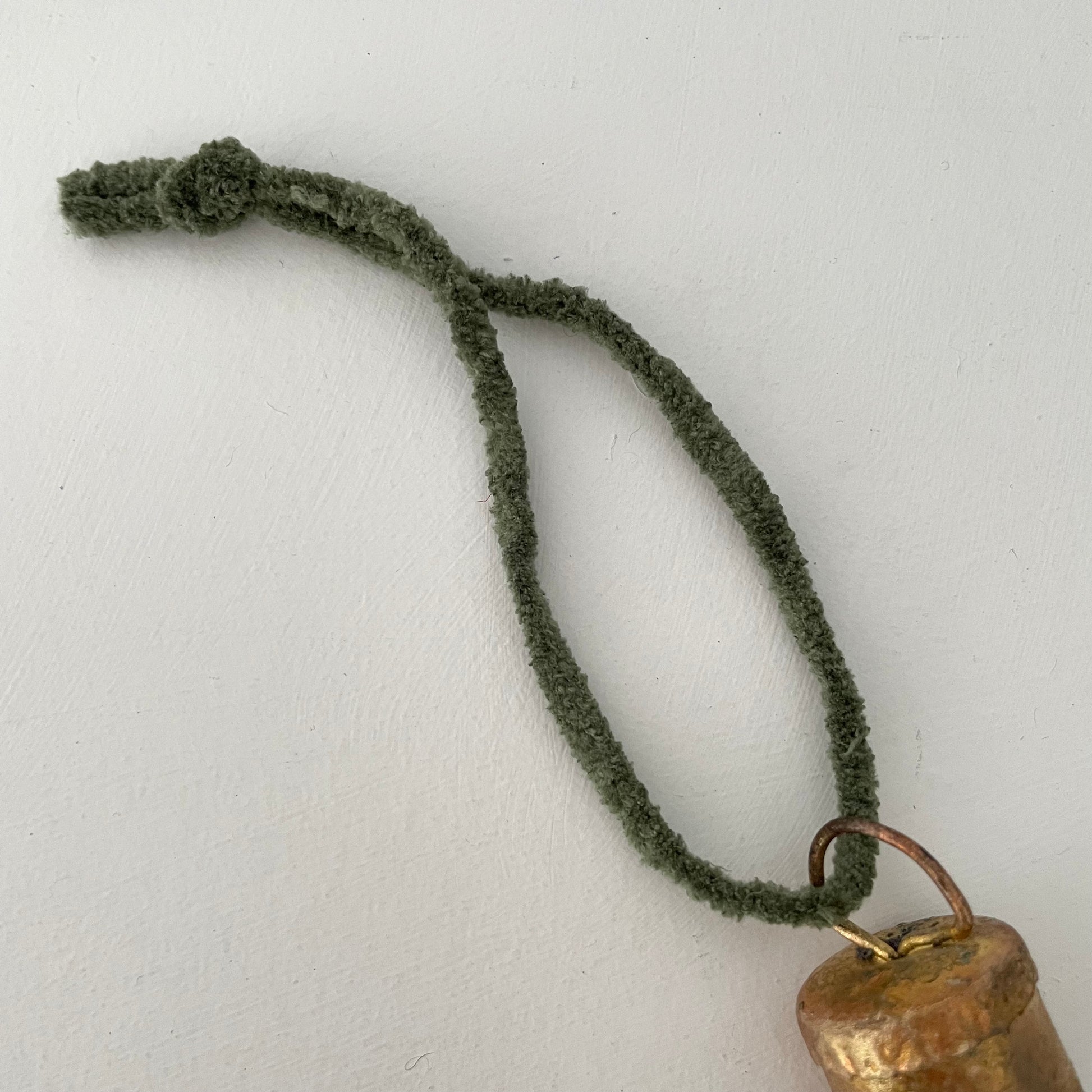 1 1/4 inch flat top tin bell with brass finish handmade ornament on hunter green chenille cord