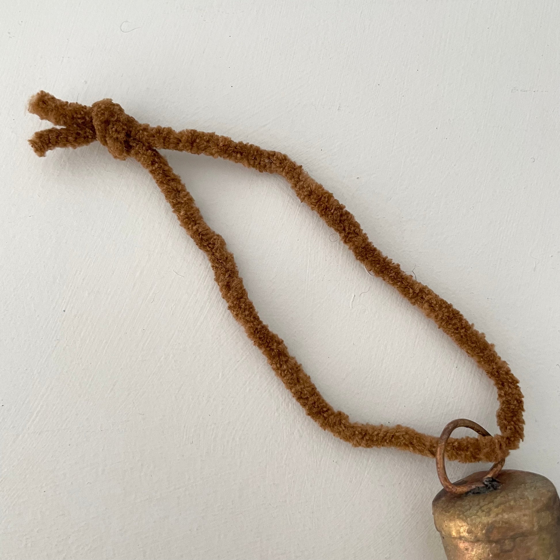 1 1/4 inch flat top tin bell with brass finish handmade ornament on cognac brown chenille cord