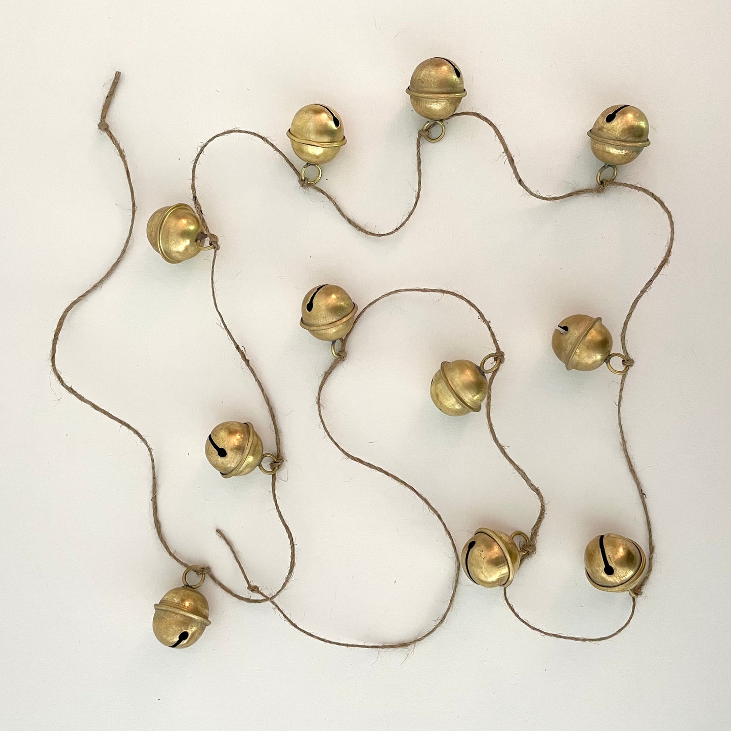 handmade brass sleigh bell garland on jute