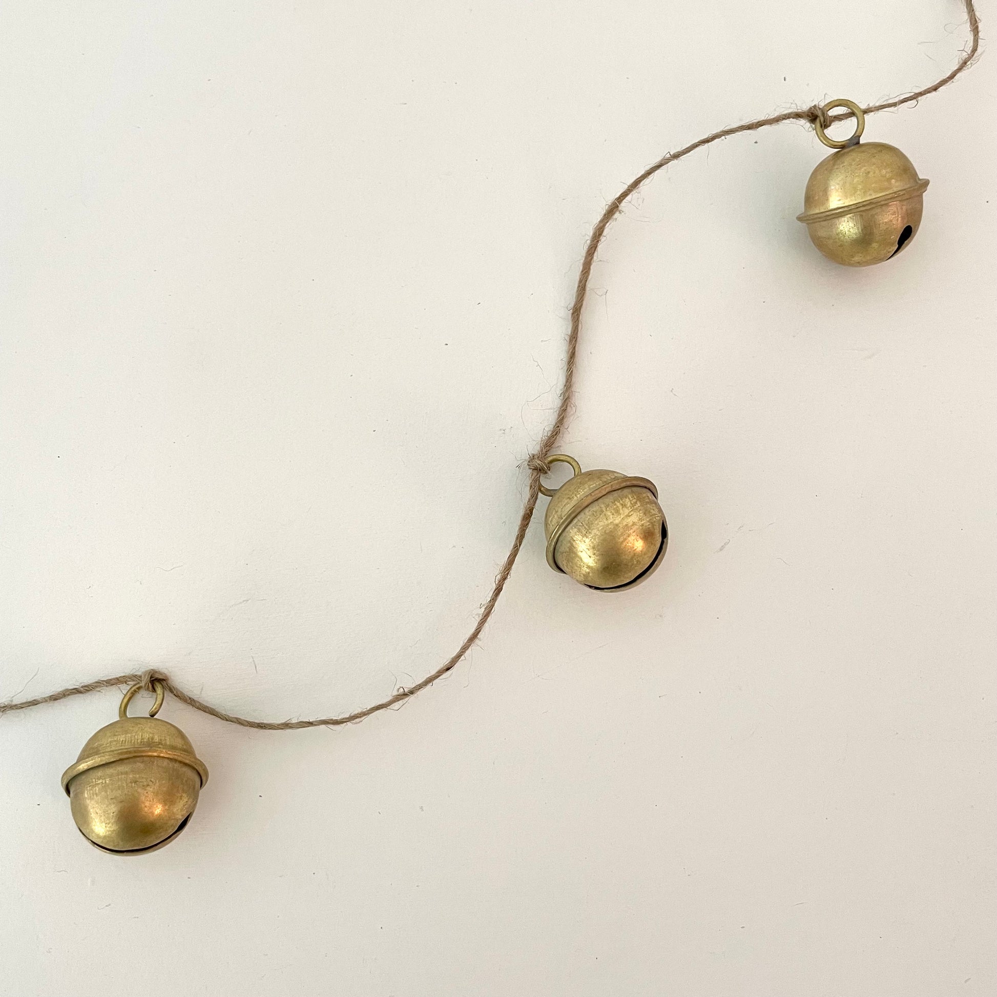 handmade brass sleigh bell garland on jute