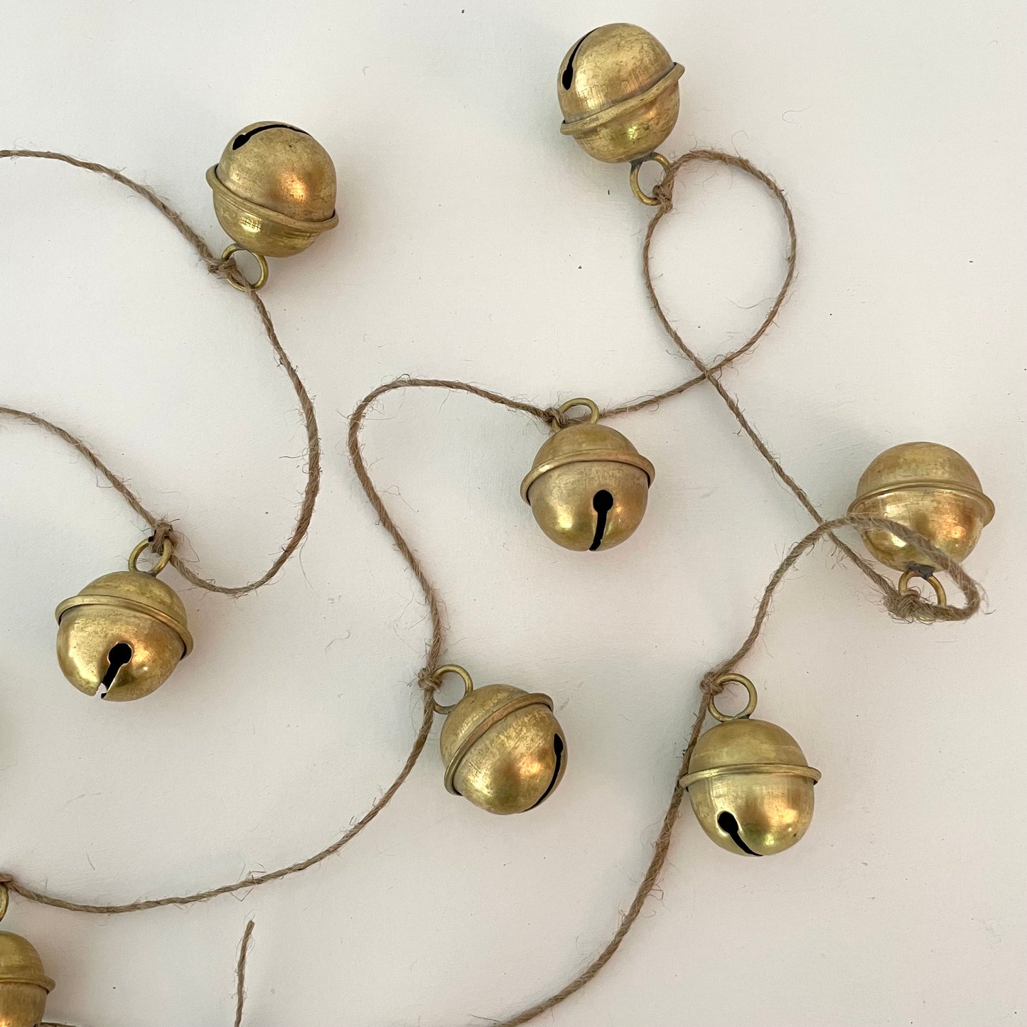 handmade brass sleigh bell garland on jute