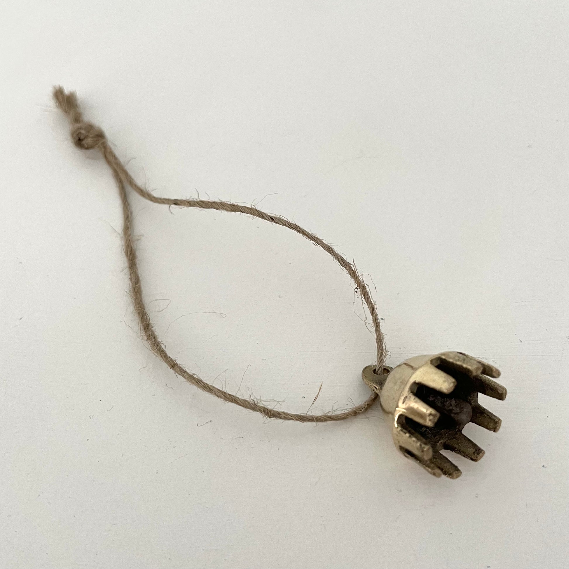 7/8" mini brass claw bell ornament on jute