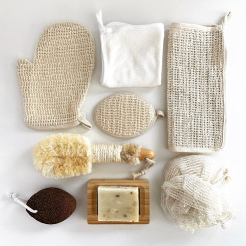 assortment of sustainable ramie fiber, bamboo, and sisal bath sponges and brushes