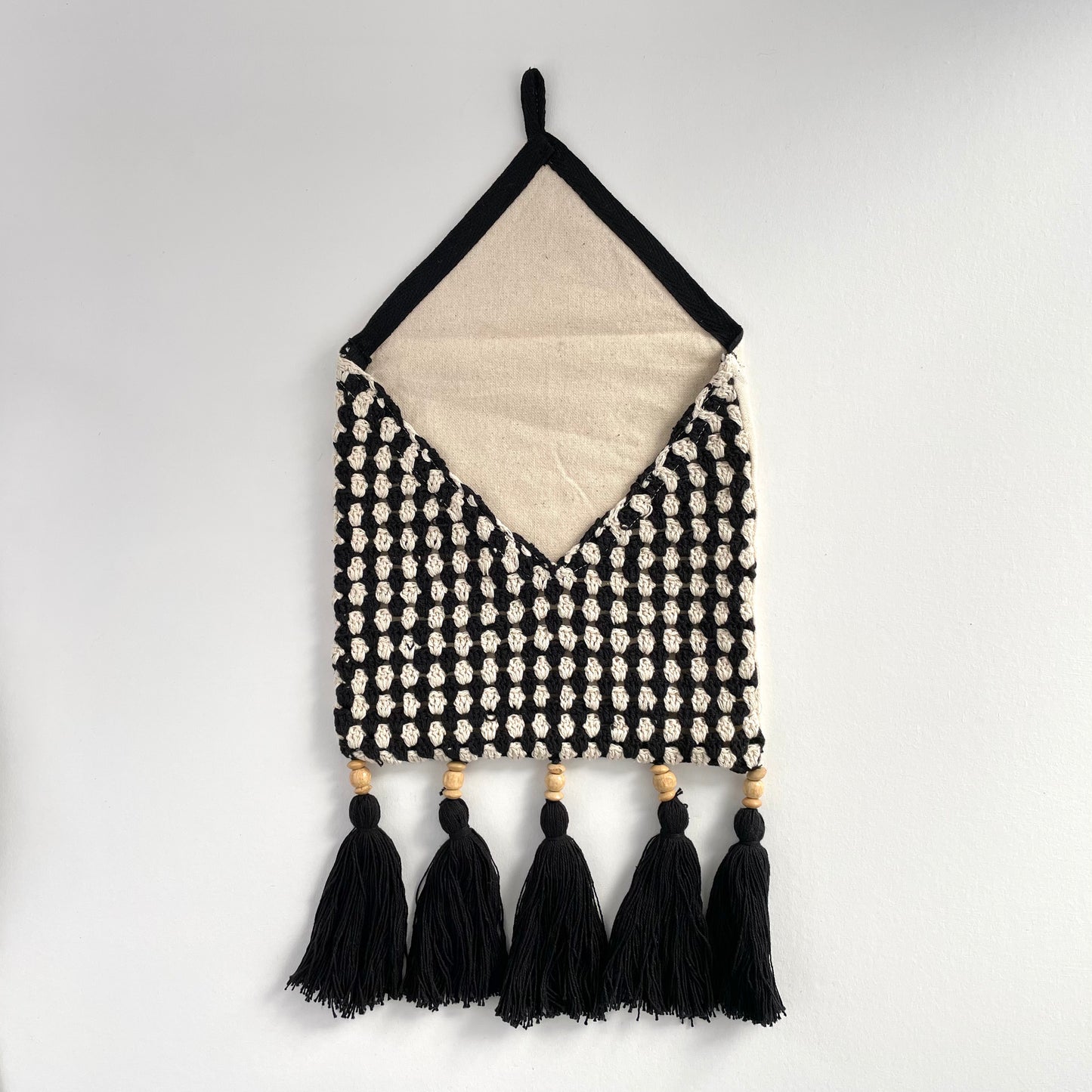 black and cream crochet boho wall pocket with fringe and beads