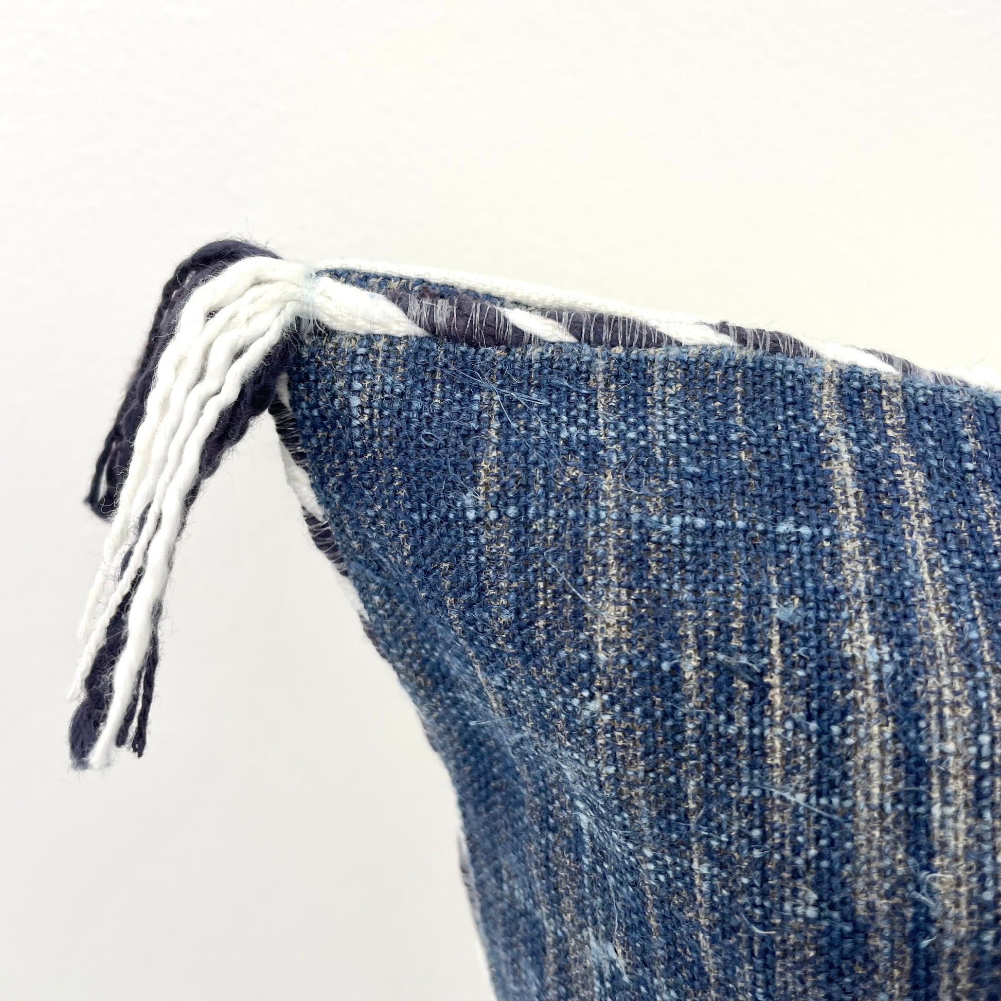 navy blue linen 18x18 square pillow cover with striped edging and tassels