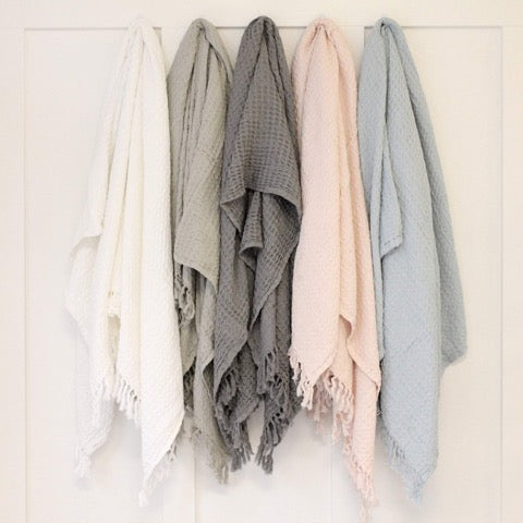 100 percent stone washed waffle fringed lightweight throw in muted neutral colors