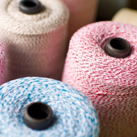 2 pound cones of striped bakers twine in a rainbow of colors for crafts and packaging