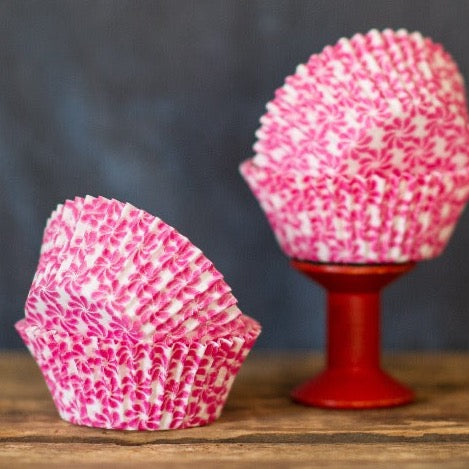 hot pink and white pinwheel flower printed paper cupcake liners party supplies