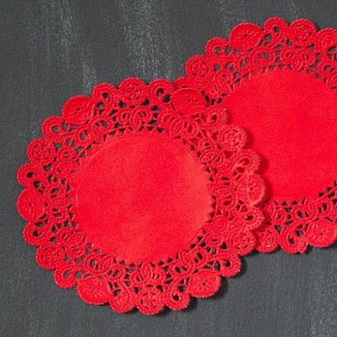 red colored round paper doilies