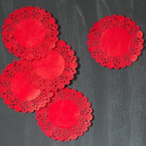 red colored round paper doilies