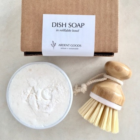 eco and sustainable solid dish soap in white porcelain bowl makes the perfect gift with a pot scrubber brush