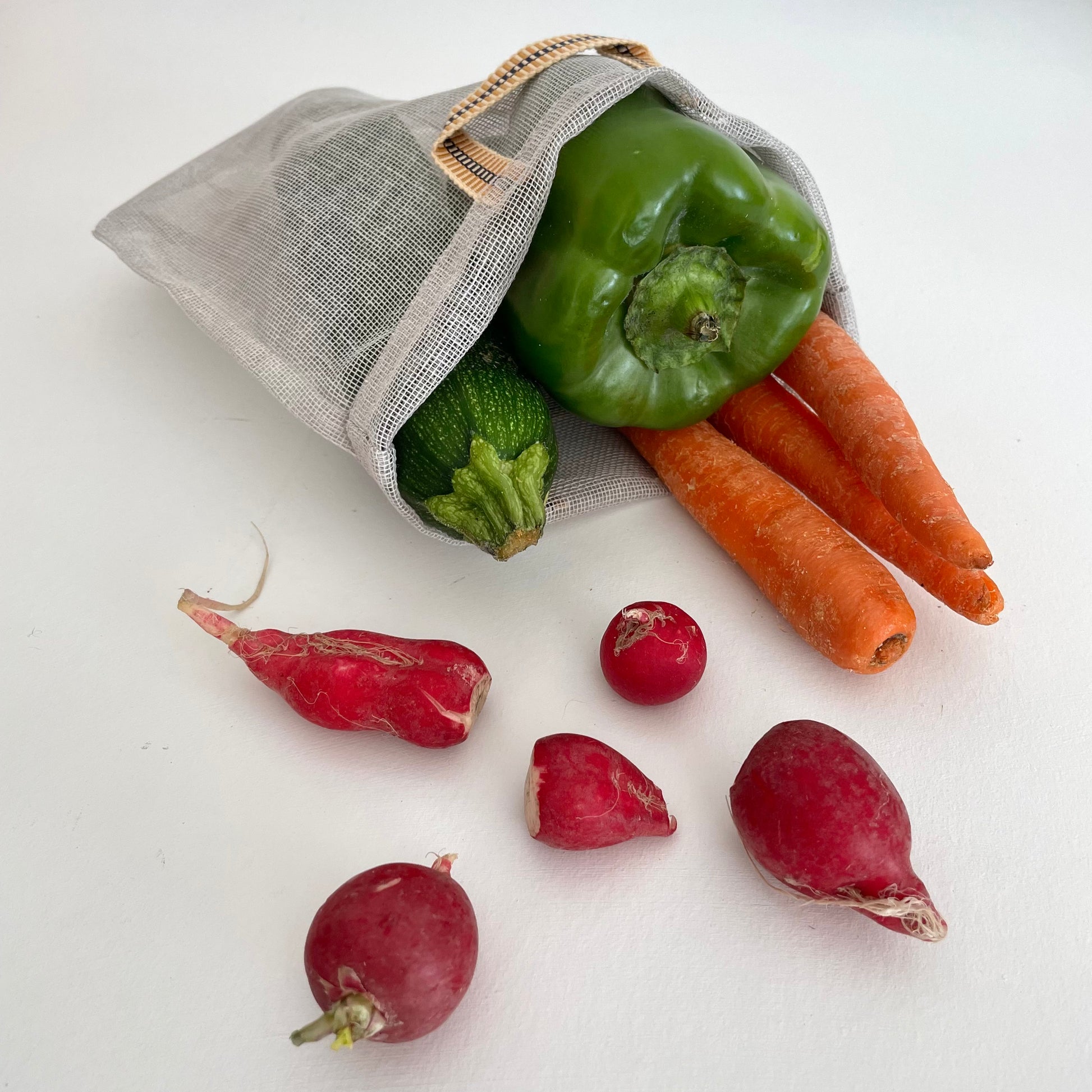grey 100 percent cotton mesh mosquito net eco produce bags with peppers carrots and radishes
