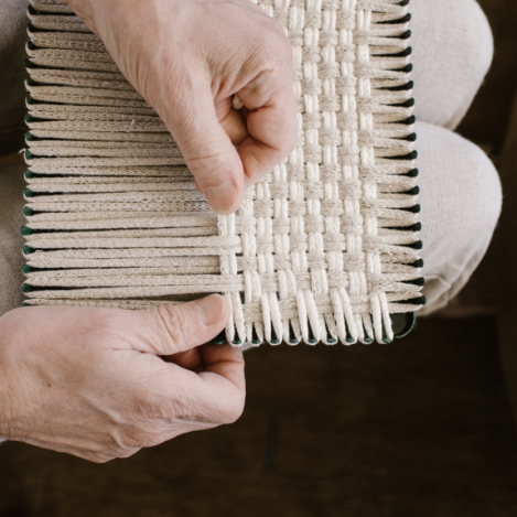 handmade 100 percent cotton bobble woven potholder or trivet on the loom for a farmhouse kitchen