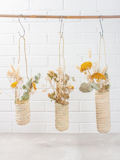 slim hanging sustainably harvested palm fiber woven hanging handmade moroccan baskets with dried flowers