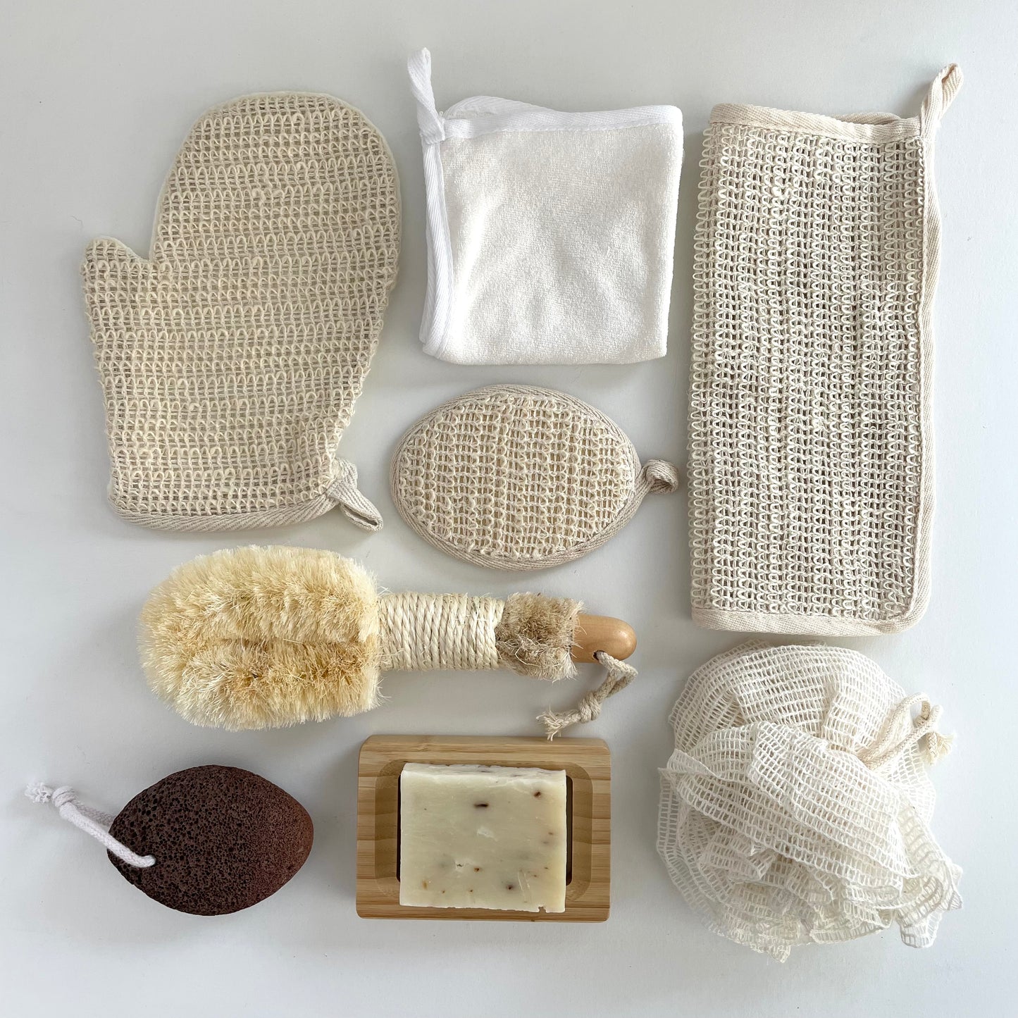 assortment of sustainable ramie fiber, bamboo, and sisal bath sponges and brushes