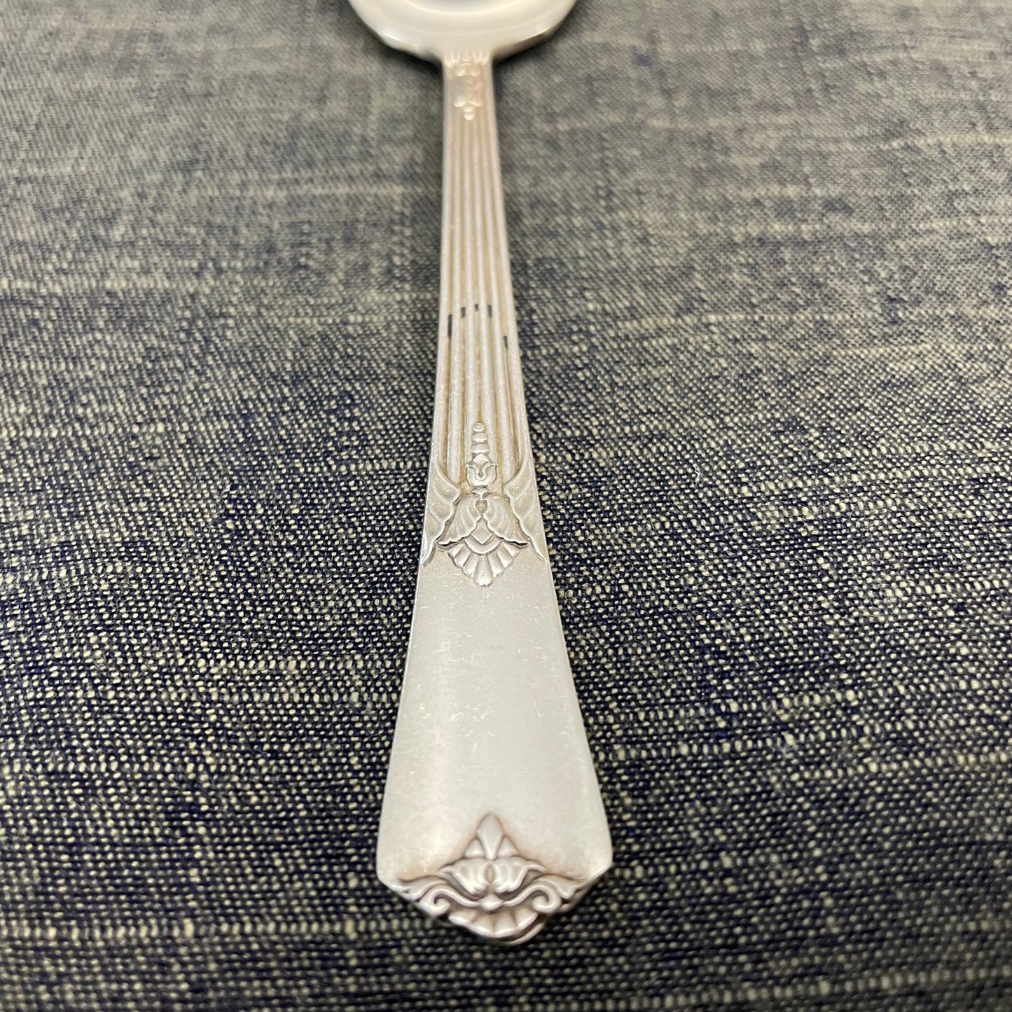 antique silver small serving spoon for serving or prop photography