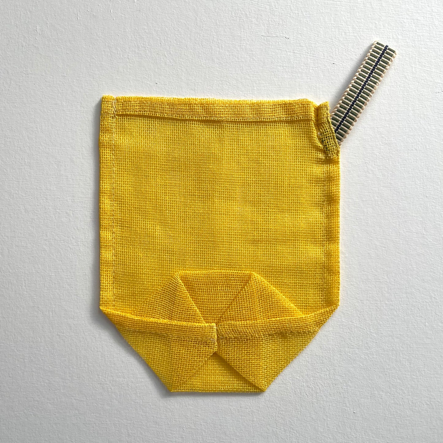 100 percent cotton mesh mosquito net yellow small eco produce bag closeup of back