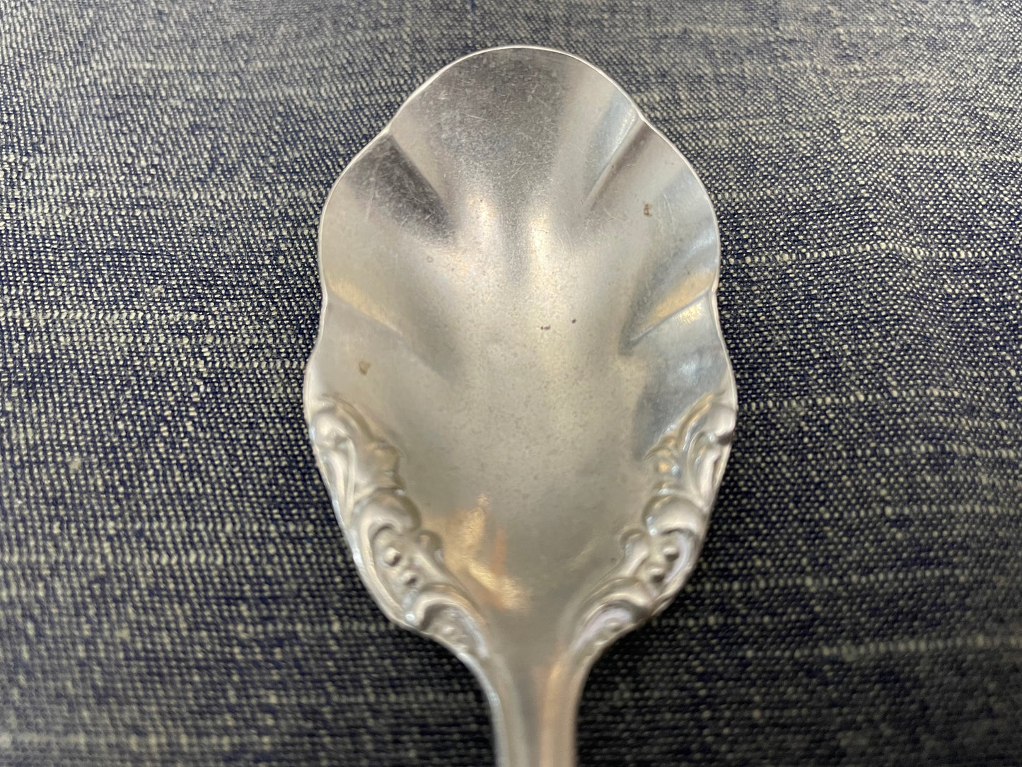 antique silver small serving spoon for serving or prop photography