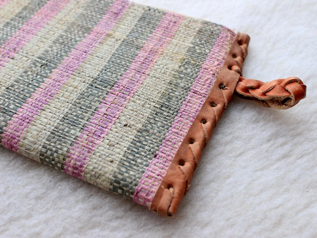 pink, green, and cream muted striped raffia woven zippered clutch with leather trim bohemian