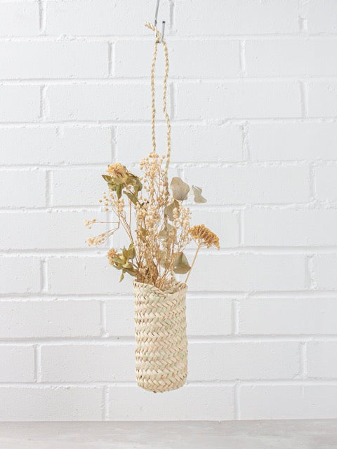 slim hanging sustainably harvested palm fiber woven hanging handmade moroccan baskets with dried flowers