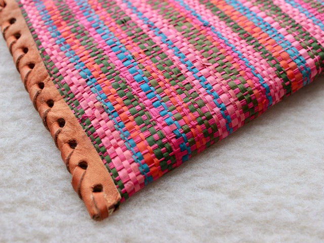 bright pink striped raffia woven zippered clutch with leather trim bohemian