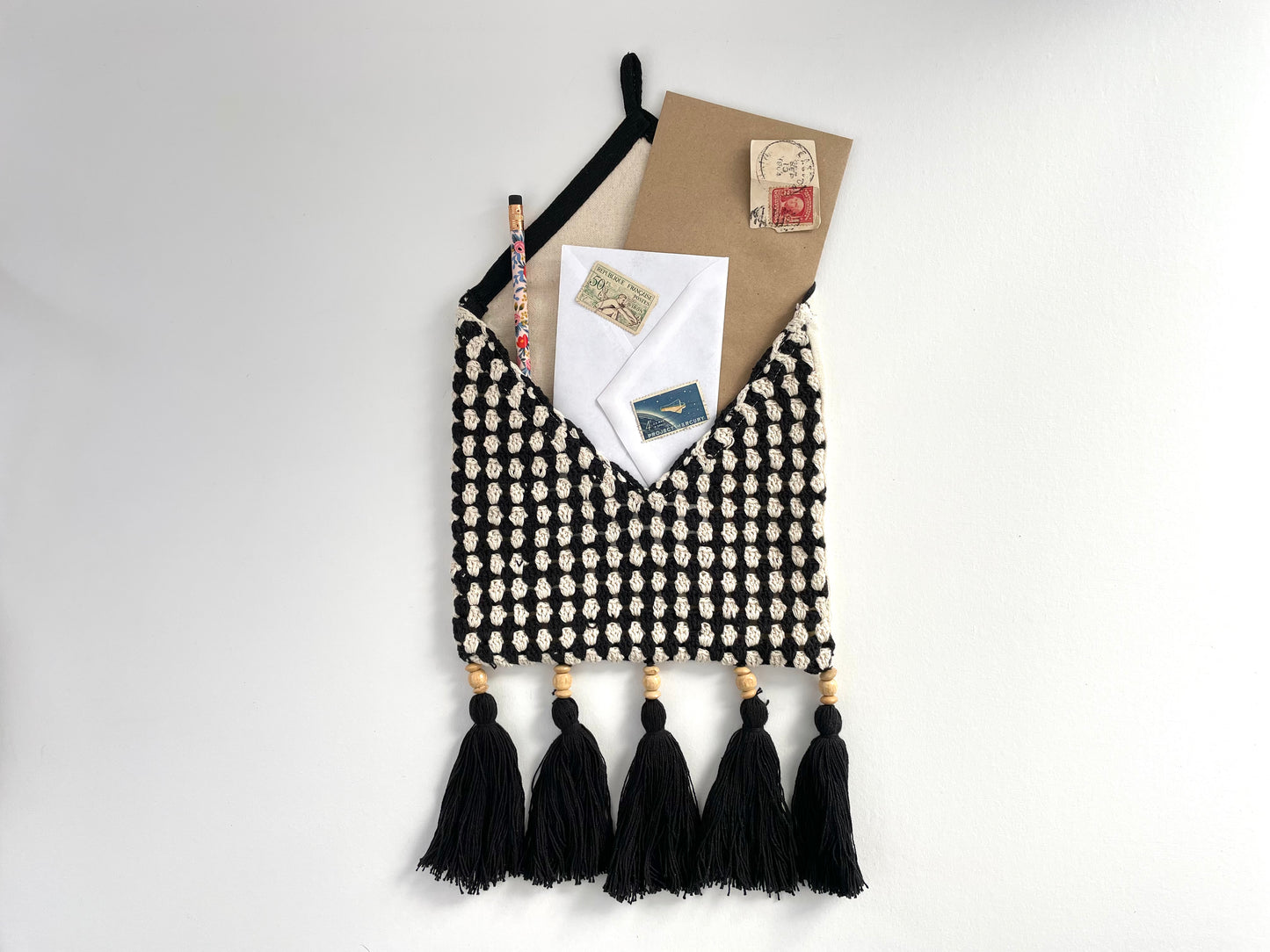 black and cream crochet boho wall pocket with fringe and beads